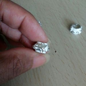 Four embellished beads